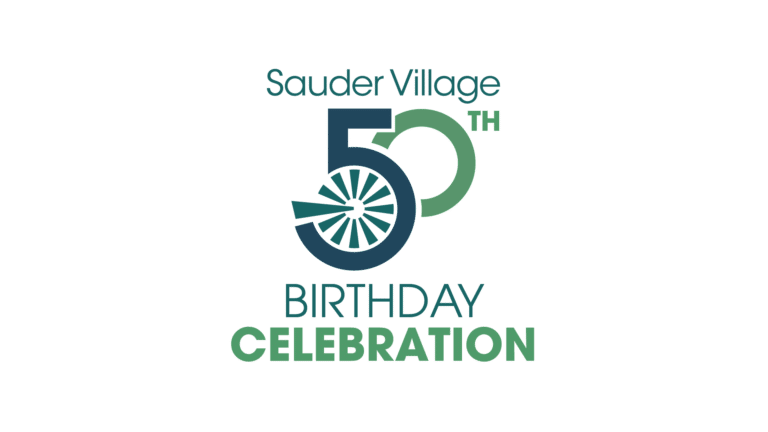 Sauder Village 50th Birthday Celebration logo with a wagon-wheel design inside the number 50