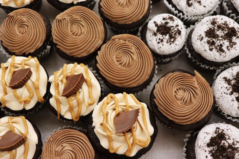 Assorted chocolate cupcakes topped with peanut butter, mocha, and cookies-and-cream frosting
