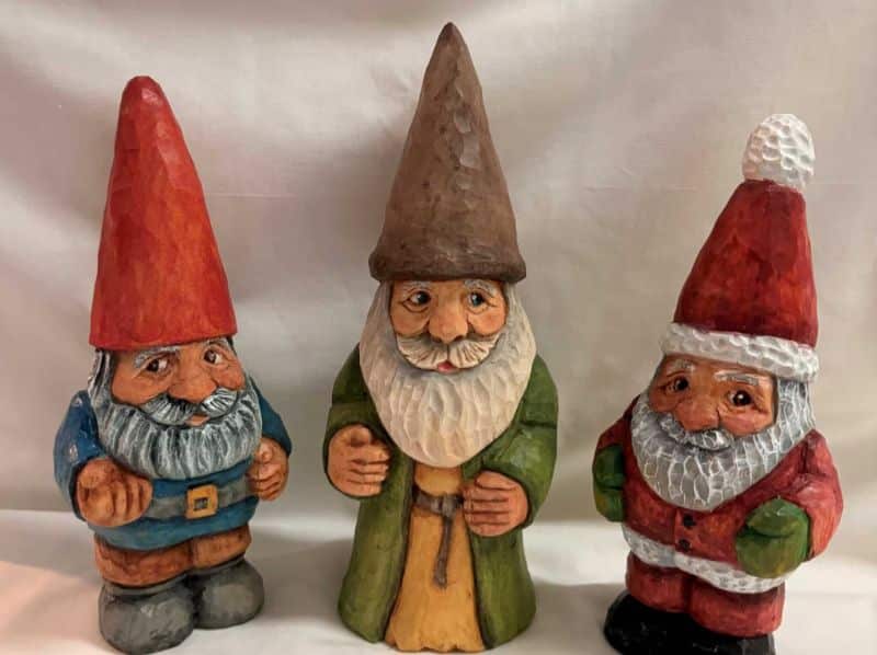 Hand-carved and painted wooden gnome, wizard and Santa figures
