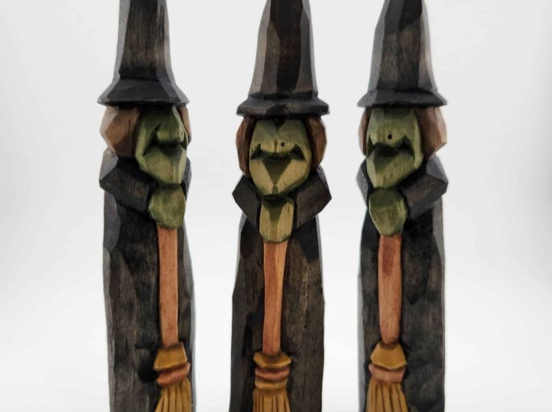 Three hand-carved wooden witch figures