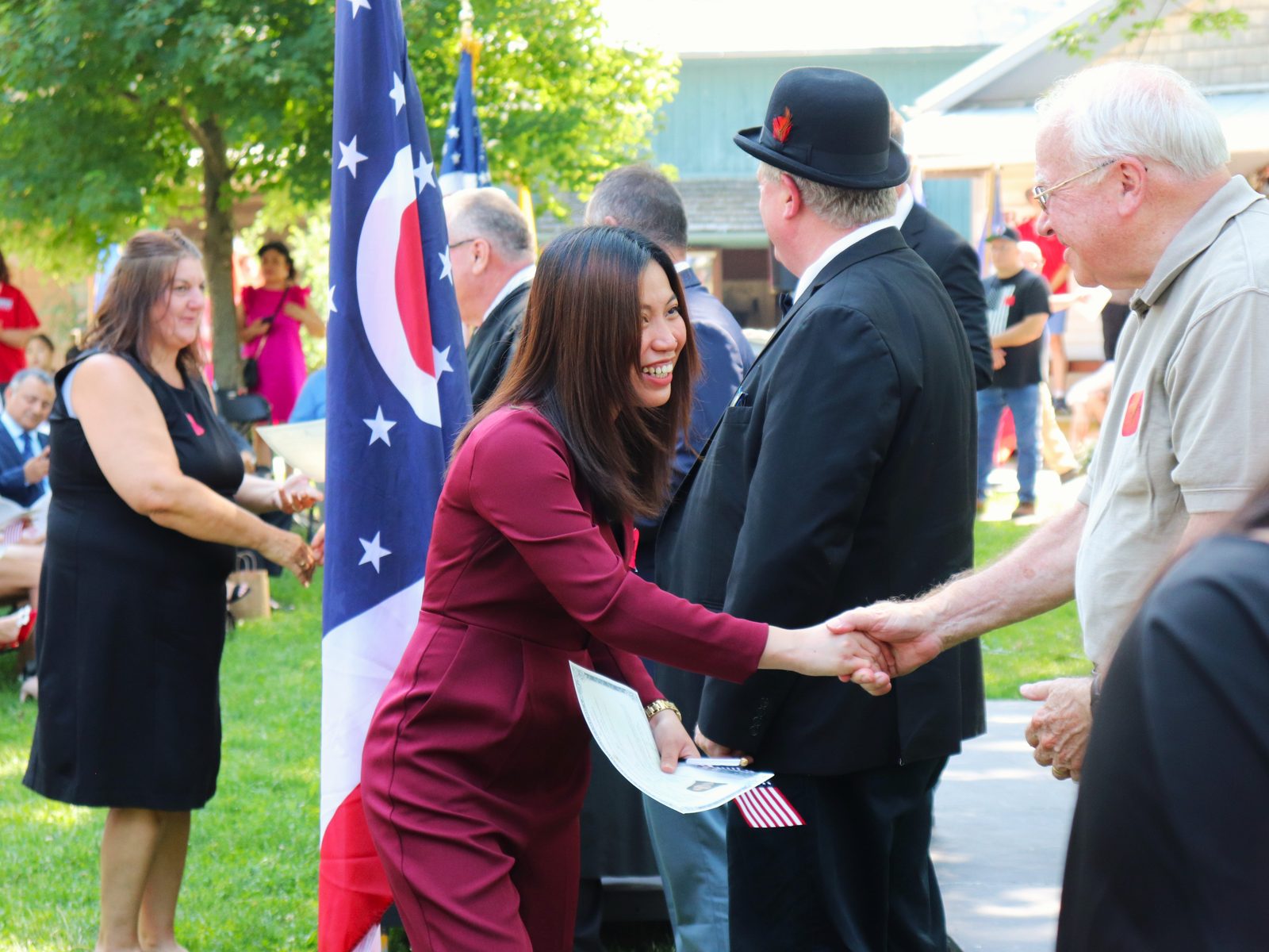 New citizens being congratulated during the naturalization ceremony at Sauder Village