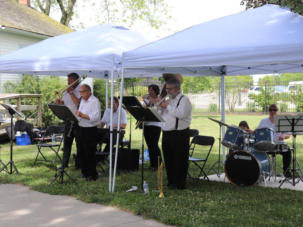 Live band performing under a tent at Sauder Village